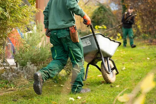 men working with garden tools